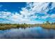 Serene canal view with lush vegetation at 6341 Biggs St, Englewood, FL 34224