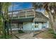 Elevated wooden deck with access to screened porch at 6341 Biggs St, Englewood, FL 34224