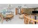 Bright dining room with wood table and chairs, overlooking a patio at 6341 Biggs St, Englewood, FL 34224
