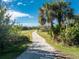 Long private driveway leading to a home at 6341 Biggs St, Englewood, FL 34224