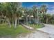 Two-story home nestled among lush tropical landscaping at 6341 Biggs St, Englewood, FL 34224