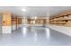 Large garage with epoxy flooring and ample storage at 6341 Biggs St, Englewood, FL 34224