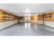 Bright and airy garage with epoxy flooring and storage at 6341 Biggs St, Englewood, FL 34224
