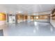 Spacious garage featuring epoxy flooring and built-in shelving at 6341 Biggs St, Englewood, FL 34224