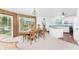 Kitchen with light cabinets, blue countertops, and modern appliances at 6341 Biggs St, Englewood, FL 34224