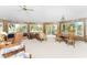 Spacious living room with large windows and ample seating at 6341 Biggs St, Englewood, FL 34224