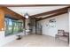 Sunlit living area with a spiral staircase and a hanging chair at 6341 Biggs St, Englewood, FL 34224