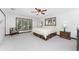 Spacious main bedroom with a king-size bed, large windows, and ample closet space at 6341 Biggs St, Englewood, FL 34224