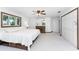 Main bedroom with king bed, large windows, and built-in drawers at 6341 Biggs St, Englewood, FL 34224