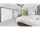 Main bedroom with king bed, large windows, and ample closet space at 6341 Biggs St, Englewood, FL 34224