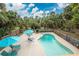 Inviting pool area with lounge chairs and umbrellas at 6341 Biggs St, Englewood, FL 34224