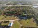 Aerial view of a large property with trees and open space at 6375 Biggs St, Englewood, FL 34224