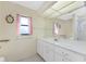 Clean bathroom with a vanity, single sink, and a shower at 6375 Biggs St, Englewood, FL 34224