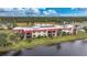 Aerial view of the condo building overlooking the water at 66 Boundary Blvd # 282, Rotonda West, FL 33947