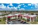 Aerial view of the condo building showcasing the parking lot and surrounding area at 66 Boundary Blvd # 282, Rotonda West, FL 33947
