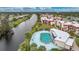 Community pool and condos near canal at 66 Boundary Blvd # 282, Rotonda West, FL 33947