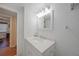 Simple bathroom with vanity and a view of the hallway at 66 Boundary Blvd # 282, Rotonda West, FL 33947