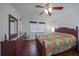 Bright bedroom with a king-size bed and hardwood floors at 66 Boundary Blvd # 282, Rotonda West, FL 33947