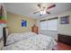 Guest bedroom with two twin beds and hardwood floors at 66 Boundary Blvd # 282, Rotonda West, FL 33947