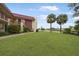 Condo building with canal views and lush landscaping at 66 Boundary Blvd # 282, Rotonda West, FL 33947