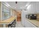 Kitchen with butcher block breakfast bar and view into dining area at 66 Boundary Blvd # 282, Rotonda West, FL 33947
