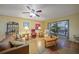 Living room with leather couches, armchairs, and geometric floor at 66 Boundary Blvd # 282, Rotonda West, FL 33947