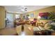 Living room with brown leather furniture and access to patio at 66 Boundary Blvd # 282, Rotonda West, FL 33947