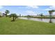 Landscaped yard with canal view at 66 Boundary Blvd # 282, Rotonda West, FL 33947
