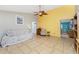 Living room with tiled floors, neutral walls and comfy seating at 660 S Broadway St, Englewood, FL 34223