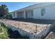 New home features a concrete patio area, ready for your backyard oasis at 7351 Lighthouse St, Englewood, FL 34224
