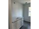 Modern bathroom vanity boasts three drawers, a white countertop, and a sleek design at 7351 Lighthouse St, Englewood, FL 34224