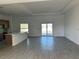 Spacious living area with tile flooring connects to a modern kitchen and offers great natural light at 7351 Lighthouse St, Englewood, FL 34224