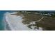 Aerial view of beach, homes and nature preserve at 7482 Palm Island Dr # 2511, Placida, FL 33946