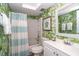 Clean bathroom with a tub shower, toilet and striped curtain at 7482 Palm Island Dr # 2511, Placida, FL 33946