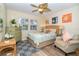 Cozy bedroom with a queen-size bed and beach-themed decor at 7482 Palm Island Dr # 2511, Placida, FL 33946