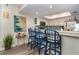 Kitchen with breakfast bar, white cabinets, stainless steel appliances, and blue accents at 7482 Palm Island Dr # 2511, Placida, FL 33946
