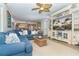 Spacious living room with sectional sofa, large TV, and coastal decor at 7482 Palm Island Dr # 2511, Placida, FL 33946