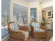 Cozy sitting area with wicker chairs and natural light from large windows at 7482 Palm Island Dr # 2511, Placida, FL 33946