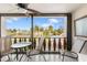 Spacious balcony with seating overlooking a tranquil waterfront view at 84 Boundary Blvd # 165, Rotonda West, FL 33947
