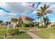 Riverhouse office building exterior with signage and palm trees at 84 Boundary Blvd # 165, Rotonda West, FL 33947