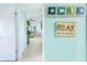 Hallway with beachy decor leading to a living area at 84 Boundary Blvd # 165, Rotonda West, FL 33947