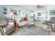 Comfortable living area with a sofa, recliner, and view of the dining area at 84 Boundary Blvd # 165, Rotonda West, FL 33947