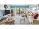 Inviting living room with sliding glass doors leading to a balcony at 84 Boundary Blvd # 165, Rotonda West, FL 33947