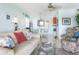 Open-concept living and dining area with light blue walls and tile floors at 84 Boundary Blvd # 165, Rotonda West, FL 33947