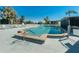 Community pool with a shallow entry and lounge chairs at 84 Boundary Blvd # 165, Rotonda West, FL 33947