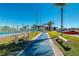 Shuffleboard court next to a tennis court and community parking lot at 84 Boundary Blvd # 165, Rotonda West, FL 33947