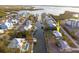 Aerial view highlighting a charming waterfront home with canal access at 9230 Griggs Rd, Englewood, FL 34224