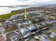 Aerial view of waterfront property with canal access and nearby community at 9230 Griggs Rd, Englewood, FL 34224