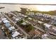 Aerial view of a waterfront home nestled in a quiet residential community at 9230 Griggs Rd, Englewood, FL 34224