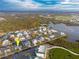 Wide aerial showcasing location and waterfront at 9230 Griggs Rd, Englewood, FL 34224
